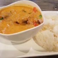 Panang Curry · Spicy. Thai red curry with bell pepper, basil and mixed with peanut sauce served with steame...
