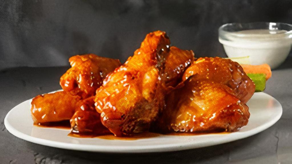 Honey Garlic Wings  · Wings tossed in a honey garlic sauce, with the perfect hint of spice..