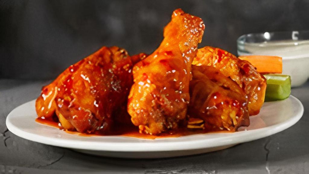 Sweet Chili Wings  · These wings start sweet, but the spicy red chili fires them up!.