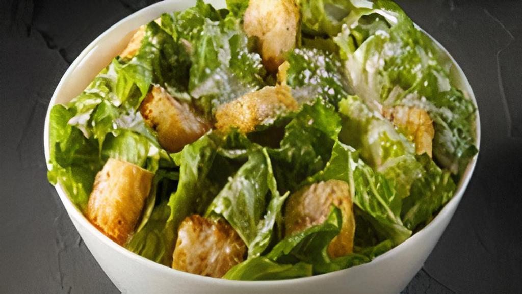 Caesar Salad · Romaine, Parmesan, croutons & served with Caesar dressing.