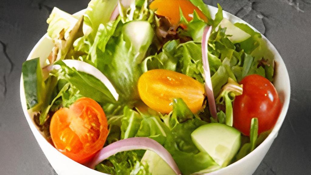 Mixed Green Salad · Mixed greens tossed with red onion, tomato, cucumbers & served with Italian dressing.