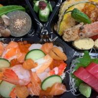 Hokkaido Chirashi Gozen · Japanese sea urchin, fresh crab, sweet shrimp, scallop and salmon roe over sushi rice with m...
