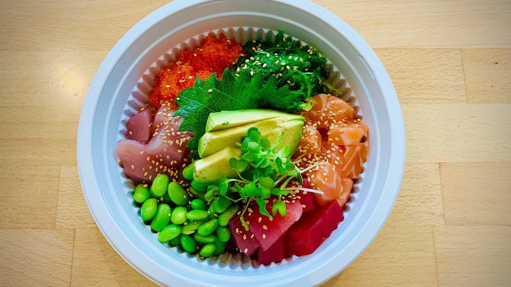 Poke Donburi · Poke bowl with tuna, salmon, albacore, tobiko, avocado, edamame, seaweed salad and garlic ponzu sauce and spicy miso sauce over sushi rice