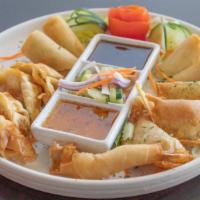 Pearl & Ploy Sampler · A platter with potstickers, egg rolls, American puffs and goong rolls