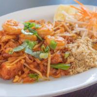 Pad Thai · Sweet and sour tamarind sauce pan fried with thin rice noodles, eggs, fried tofu and bean sp...