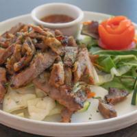 Bangkok BBQ Pork · Char-broiled pork marinated with chopped garlic coriander and thai herbs served with homemad...