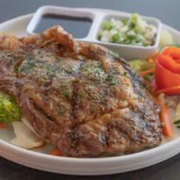 Rib Eye Steak · Grilled rib eye steak; served with homemade teriyaki sauce, onion sauce, and sautéed mixed v...