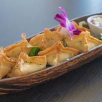 Crab Rangoon · Wild caught crab meat,cream cheese,green onion, and garlic wrapped in wonton skin to serve w...