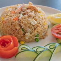 Crab Fried Rice · Stir- fried rice with wild caught crab claw meat, eggs, onions, carrots and peas.