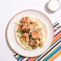 Grilled Shrimp Taco Taco · Grilled shrimp, pico de gallo, chopped lettuce, cilantro, and salsa on a corn tortilla.