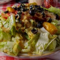 Gaspare's Special Salad · Gluten free. Romaine, tomatoes, olives, onions, garlic and pepperoncini. Regular size good f...