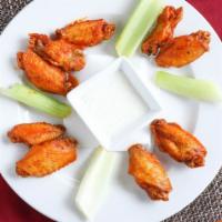 Chicken Wings Spicy Buffalo Sauce or Sweet Chili · Also comes with Ranch and celery.