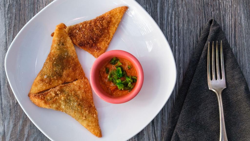 Sambussa (4 Pieces) · Thin flaky dough stuffed with your choice of lentils or ground beef spiced with different onions and peppers served with tomato based spicy dip.