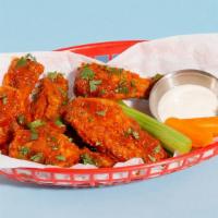 Fried Sriracha Chicken Wings · (6) Tossed with sriracha, butter, lemon, and cilantro.