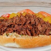 The Drippin's Po Boy · Shredded roast beef drenched in au jus and dressed without mayo. Shredded cabbage, tomato, p...