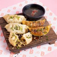 Pork Gyoza (5 pcs) · Savory pork and leek dumplings. With (choose 1): Hot sauce, Hoisin sauce, Ponzu citrus soy s...