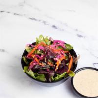 Mixed Green Salad with Sesame Dressing · Mixed green, shredded carrots, cabbage with sesame dressing.