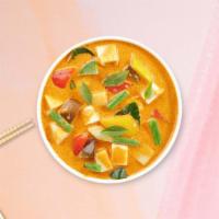 Mellow Yellow Curry · Yellow curry with tofu, potatoes, carrots, and onions cooked in coconut milk.