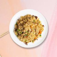 Perfect Combo Fried Rice · Fried rice with green peas, carrots, and onions.