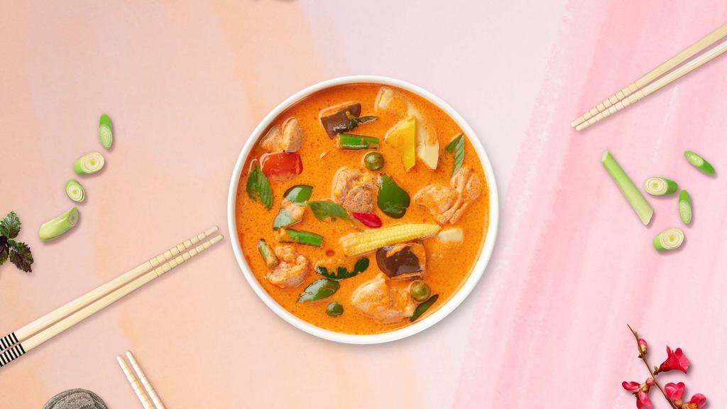 P Is For Curry · Panang curry with bell peppers and mushrooms cooked in coconut milk topped with crispy Thai basil.
