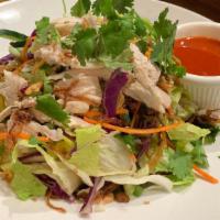 Burmese Chicken Salad · Cucumber, cilantro, cabbage, carrot, chili sauce, wonton chip, and sesame seed