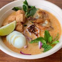 Laksa · Coconut chicken soup with lemongrass, kaffir lime leaf, chili, chicken shrimp, tofu, egg, ba...