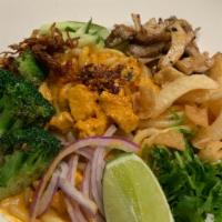 Vegan Tempeh Curry Noodles · Rice noodles in coconut curry sauce, with tempeh, cucumbers, broccoli, mushrooms, cilantro, ...