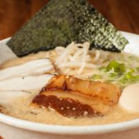 Tonkotsu Deluxe Ramen · Bean sprout, green onions, sesame, chashu, kakuni (slow cooked pork belly), egg, and dry sea...