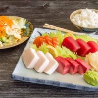 Assorted Sashimi (12 Pieces) · raw. Includes steam rice.