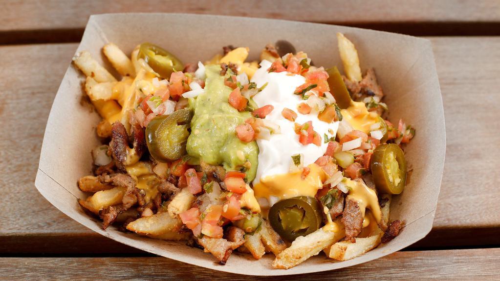 Sisig Fries · French fries topped with nacho cheese, sour cream, guacamole, pico de gallo and pickled jalapenos.
