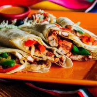 Fajita-Style Quesadilla · Your choice of grilled chicken or steak, with Monterey jack cheese mixed with onions, red an...