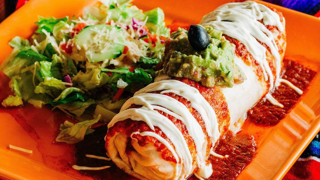 Chile Relleno Burrito · Flour tortilla stuffed with a Chile relleno, rice, beans, cheese and salsa mexicana. Topped with relleno sauce. Sour cream and guacamole.