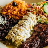 Enchilada Suiza & Steak · One corn tortilla stuffed with cheese and topped with green sauce and sour cream. Accompanie...