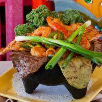 Molcajete · Sizziling volcanic rock molcajete is a combination of grilled skirt steak, grilled chicken b...