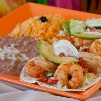 Shrimp Tacos · Two sautéed tiger shrimp tacos with chipotle creamy sauce. Shredded lettuce, salsa mexicana....