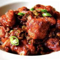 Chilli Chicken · Crispy marinated chicken is sautéed in a spicy sweet sauce along with onions and bell peppers.