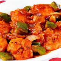Chilli Prawns · A sizzling combination of sauteed prawns, umpteen sauces and fresh greens onions