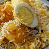Egg Biryani · Dish made by cooking together fragrant long grain basmati rice, spiced hard boiled eggs, per...