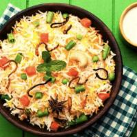 Veg Biryani · Vegetable biryani is an aromatic rice dish made by cooking basmati rice with mix veggies, he...