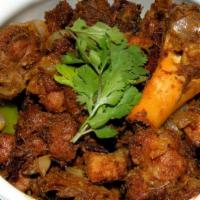 Mutton Pepper Roast · A dry preparation of mutton with lots of onions, curry leaves and freshly ground pepper and ...