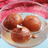 Gulab Jamun · This is a traditional Indian dessert. Spongy milky balls soaked in rose scented syrup.