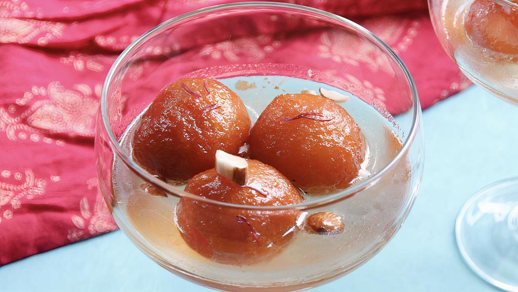 Gulab Jamun · This is a traditional Indian dessert. Spongy milky balls soaked in rose scented syrup.
