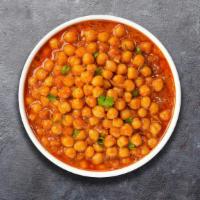 Chickpea In A Pod Masala · Whole chickpeas, slow cooked till soft in an onion and tomato curry with Indian whole spices.
