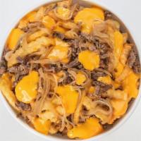 Loaded Cheesesteak Fries · Thinly sliced steak & griddled onions with cheese sauce on a bed of French fries