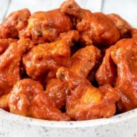 Classic Buffalo Wings · Incredibly crispy, golden fried wings tossed with tangy Buffalo Sauce. Choose classic or bon...