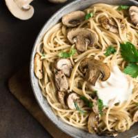 Mushroom Fettuccine Pasta · Fresh warm fettuccine pasta mixed with white sauce and cooked mushrooms.