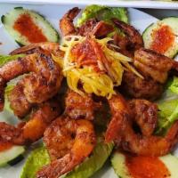Michelada shrimps · Seven grill jumbo shrimp mild spicy chipotle sauce, cucumber and oranges slices