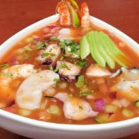 Levanta Muertos · Raw cooked shrimp, raw shrimp/ Octupus and oyster scallops, raw, lemon, avocado and serve co...