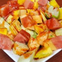Botana De Frutas · Pineapple, watermelon, cucumber, mango, cantaloupe, lemon, Tajin and chamoy