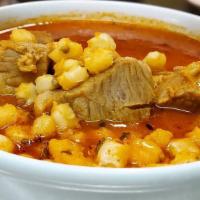 Pozole · pork meat soup with hominy, serve with lemon, cabbage, yellow onions, oregano, spicy oil chi...